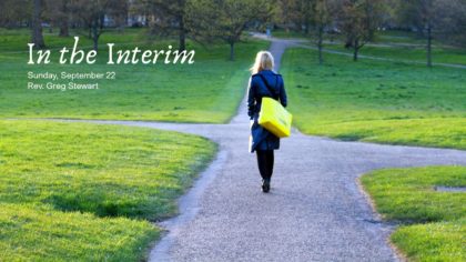 Young woman standing at crossroads on a college campus